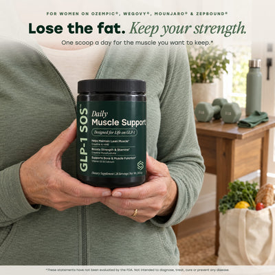 Woman holding Daily Muscle Support: lose the fat, keep your strength